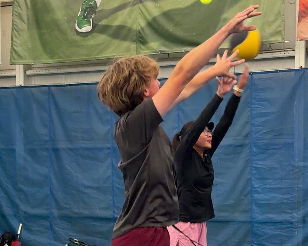 Junior players doing a medicine ball drill during training